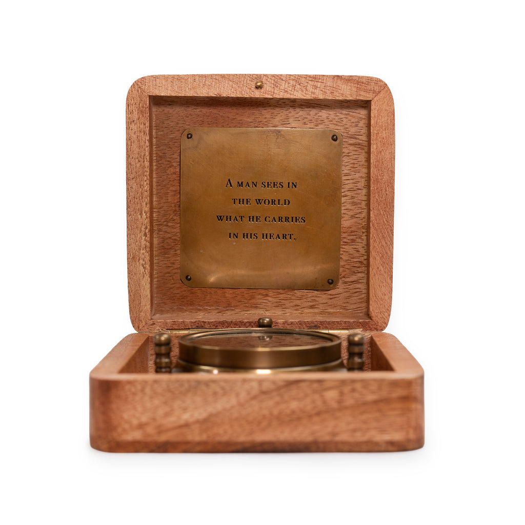A Man Sees Tripod Compass in Wooden Box