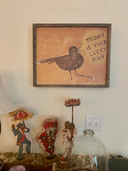 yellow art prints with black bird and "today is your lucky day"