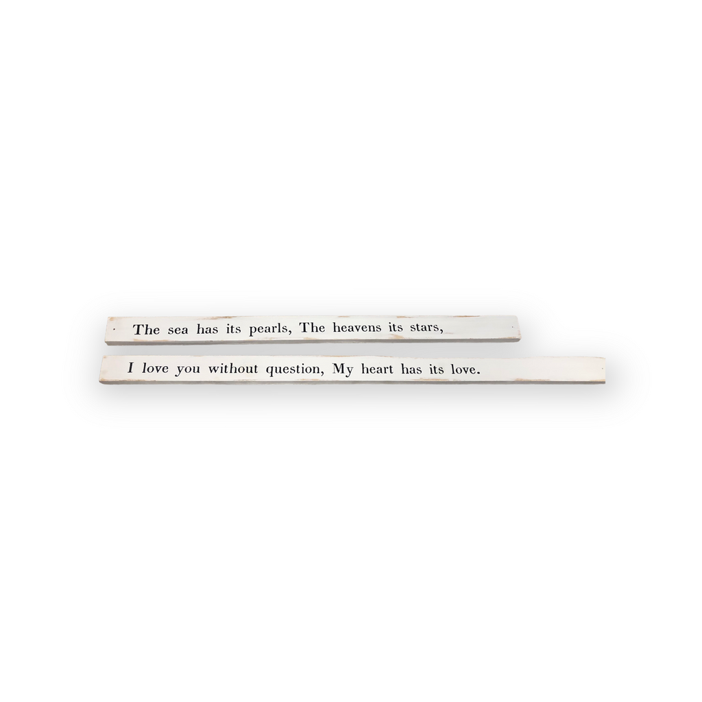 Poetry stick quotes across two wooden boards