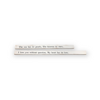 Poetry stick quotes across two wooden boards