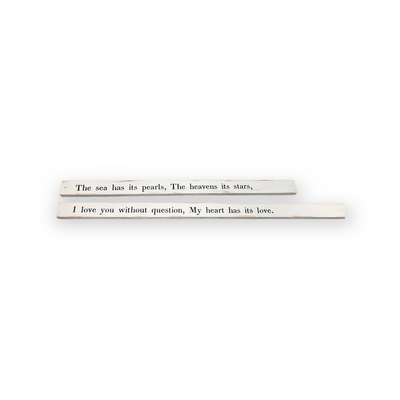 Poetry stick quotes across two wooden boards